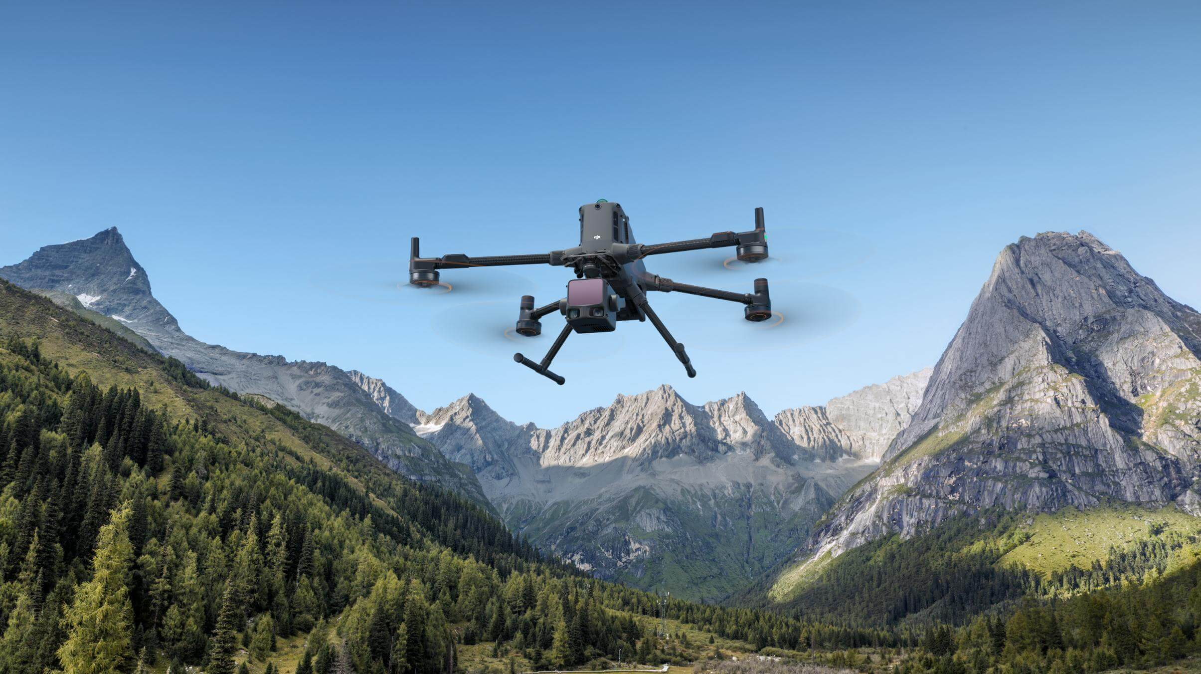 DJI enterprise drone flying above a mountain valley